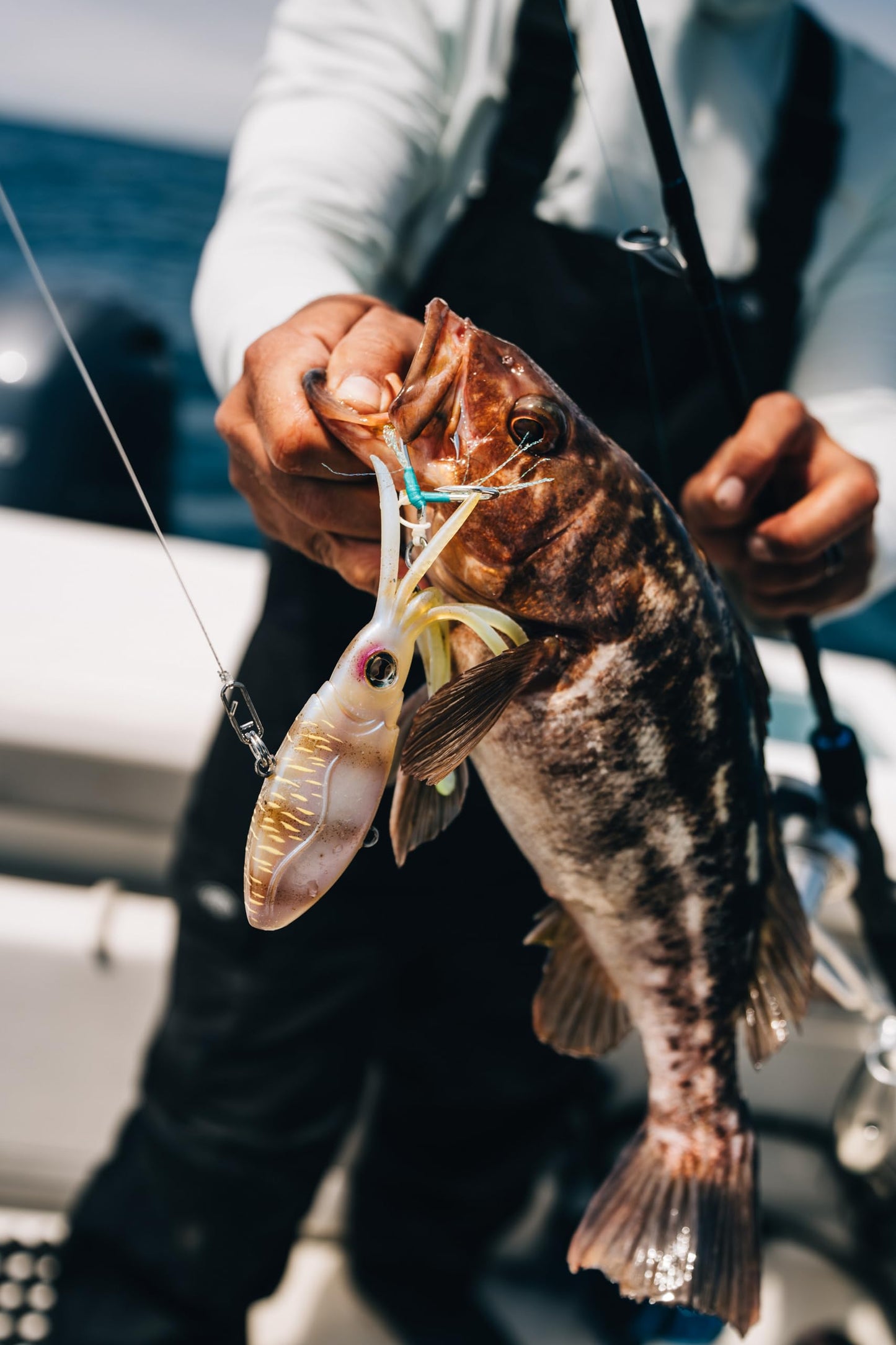 Nomad Design Squidtrex Patented Vibrating Fishing Lure- Scent Added TPE Soft Plastic Lure for Saltwater w/Strong BKK Assist Hooks, Fishing Bait that Catches Many Species, 95mm 3 3/4" 1oz- Aqua Ghost